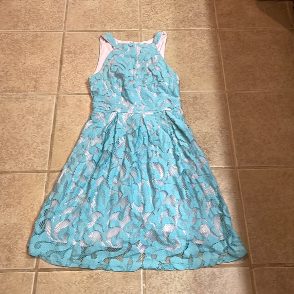 Beautiful ladies Coconnino dress Lining is a soft pink outer is lace blue.